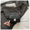 Bolso de nicho de alta calidad con patrón de diamantes texturizado para mujer, nuevo y moderno de moda para el verano 2026, cadena versátil, bolso de hombro cruzado tipo ins