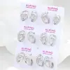 Pendientes Xuping de estilo ruso con forma de lágrima, transfronterizos europeos y americanos, hechos de aleación de cobre con baño blanco, que exudan un encanto de lujo ligero y elegante, con un diseño de doble anillo
