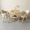 Mesas y sillas de negociación de alta calidad, adecuadas para tiendas de té de leche y cafeterías, áreas de recepción de ocio y mesas redondas pequeñas para balcones en bed & breakfasts, con una mesa y sillas de comedor de estilo nórdico