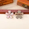 Brocado Song de cinco pétalos de flor de cerezo acabado en el pecho puntada colorida tela de brocado Song broche de flor de cerezo de aleación accesorios de ropa de estilo antiguo lote mixto