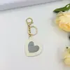 Espelho de Bolso Portátil com Pingente de Chaveiro Coração de Pêssego Desenho Animado Menina Espelho de Maquiagem Criativo Fofo Versátil Bolsa Transfronteiriça