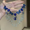 Colar multicamadas de gota d'água com borboleta verde de alta qualidade para mulheres, estilo moderno e descolado, acessório de corrente clavicular de alta qualidade.