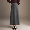 Moderna falda midi de lunares con cintura elástica, corte ajustado para mujer, nuevo estilo otoño 2026, falda de paraguas de corte recto, versátil y que realza la cadera