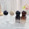 Botella de perfume redonda con forma de bola y diseño de montaña cilíndrica, botella con atomizador, botella vacía, en stock, empaque de fragancia, decantador de perfume, portátil