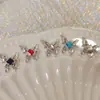Joyería de uñas nueva de网红 aleación mariposa líquida mariposa plateada estéreo cuadrado de diamante decoración de uñas de diamante al por mayor