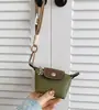 Bolsa Super Mini Dumpling 2025 Verão Nova Nylon Francês Couro Moeda Fone de Ouvido Batom Chave Pequena Bolsa Pendurada Atacado