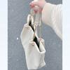 Bolso de mujer portátil de gran capacidad con cadena de moda para ir al trabajo, versátil, nuevo verano 2023, bolso tote texturizado para hombro y axila
