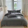 Nuevo juego de sábanas simple de cuatro piezas, funda de edredón, ropa de cama, funda de edredón de color liso, juego de tres piezas para cama de dormitorio de estudiante