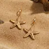 Brincos de metal em formato de estrela-do-mar e concha, estilo férias de verão, design simples e único, brincos versáteis com um toque de luxo leve e sofisticado