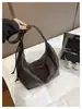 2026 Nueva Bolso Cruzado Elegante Versátil de un Solo Hombro Bolso Tipo Dumpling con Patrón Tejido de Moda Bolso Casual Retro de Gran Capacidad para Mujer