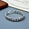 Pulseira de corrente masculina Yuhongtong com padrão de grama de rattan no corpo, personalidade simples, largura da corrente 12mm, pulseira Joker de indústria pesada, outlet de fábrica de joias