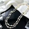 Colección Larga de Collares Superpuestos de Perlas Swarovski para Mujer, Estilo Lujo Ligero, Cadena Versátil para Suéter con un Toque de Alta Gama, Venta al por Mayor Otoño e Invierno