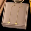 Pendientes de Borla de Acero de Titanio de Dongguan Transfronterizos con un Diseño Único Japonés y Coreano, Pendientes de Corazón Hueco de Amor para Mujer, Simples y Elegantes