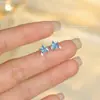 Brincos de Prata de Lei S925 Estilo Coreano Azul Claro Pequenos Frescos de Estrela para Mulheres com Design de Nicho de Cristal Pontiagudo Brincos de Estrela da Moda