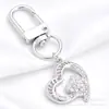 Lujo Ligero Chapado en Oro Full Diamante Charm Hebilla en Forma de D Colgante Hueco en Forma de Corazón Accesorios para Bolsos Llaves Fábrica Stock Mayorista