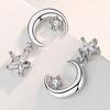 Cao Shi cross-border brincos de lua nova brincos assimétricos de estrela coreana brincos curtos de borla femininos atacado