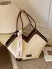 Bolso de hombro tejido con patrón transfronterizo para mujer, nuevo bolso de hombro de diseño de nicho de moda otoño e invierno 2026, bolso de mano popular