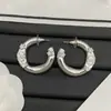 Pendientes Estilo Chanel Modelo Nuevo 2025 con Logo, Diseño de Estrella Doble C Incrustada con Diamantes, Aguja de Plata, Pendientes de Lujo de Alta Gama al por Mayor