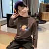 Ropa interior térmica para niños 2026 Nueva Ropa Otoño/Invierno Cuello Semi-Alto Camiseta de Manga Larga Cepillada para Niños Top Térmico de Felpa Tendencia