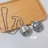 Colgante de gato de la suerte hueco de plata imitación vintage de Xizang cadena larga para suéter accesorio de llavero venta al por mayor