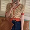 Cárdigan corto vintage de punto con cuello en V, fino, de verano, informal, de cintura alta y con estampado floral en contraste.