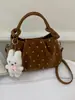 Bolso plisado de nicho súper popular para mujer, nuevo bolso cruzado versátil de moda 2026, exquisito bolso de mano tipo dumpling, bolso tote pequeño
