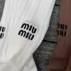 Miumiu calcetines de moda para mujer otoño e invierno calcetines de caña media letras bordadas calcetines de hada punto doble