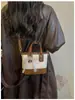 Bolso Tote Pequeño Súper Caliente para Viaje de Trabajo de Mujer 2026 Nuevo Verano Textura Tejida Retro Bolso Cubo de Hombro Único Cruzado