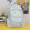 Mochila de estudante de ensino médio graffiti transfronteiriça universitário nicho versátil estampa de estrela bolsa escolar mochila de grande capacidade feminina