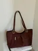 Bolso de mano vintage de gamuza estilo coreano para mujer, nuevo y moderno para otoño e invierno 2026, bolso de hombro de alta gama de gran capacidad para el trabajo