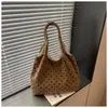 Bolso tote minimalista de lunares transfronterizo para mujer, nueva colección 2026, bolso de mano y bandolera versátil de alta gama de pana