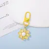 Nuevos llaveros colgantes de resina de girasol transparentes como el hielo, accesorios para hacer tú mismo, dijes para bolsas con cuentas, colgantes terminados hechos a mano al por mayor