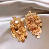 Brincos de borla redonda de lantejoulas prateadas brincos de moda transfronteiriça para mulheres brincos de senso de luxo leve e sofisticado novos brincos de temperamento atacado