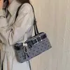Bolso de mano nuevo para mujer 2026, bolso de hombro para el trabajo, bolso de nicho estilo coreano, bolso versátil para el antebrazo, exquisito y moderno con lunares
