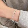 Pulsera minimalista estilo lazo plateado hueso de serpiente para mujer, lujo ligero, nicho, alta gama, elegante, accesorios para estudiante/novia