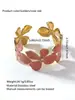El brazalete abierto de acero inoxidable con goteo de aceite más vendido de Temu es un brazalete de acero de titanio de lujo ligero, de nicho, de alta gama que no se decolora