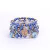 Pulsera de borlas con colgante de amor hueco multicapa de estilo bohemio de venta caliente europeo y americano, juego de joyería multicapa con cuentas de vidrio