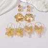 Nuevos pendientes largos de metal con diseño de flor hueca dorada, de lujo ligero de alta gama, transfronterizos, para mujer, joyería de moda y sencilla