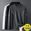 Camiseta de manga larga para hombre para primavera y otoño, disponible en blanco puro y negro, con cuello redondo, adecuada como capa base o camiseta interior, y un diseño fino y ligero para usar en otoño