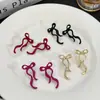 Nuevos aretes de lazo de cinta transfronterizos, aretes simétricos de moda, aretes del mismo estilo más vendidos en Amazon, venta al por mayor del fabricante