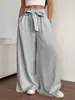 Pantalones de pierna ancha para mujer de comercio exterior transfronterizo en stock, pantalones largos holgados de moda, pantalones drapeados versátiles casuales de color brillante para mujer de primavera y verano