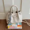 Bolso tipo cubo versátil para el verano 2026, simple y elegante, nuevo bolso de mano de moda, estilo coreano, bolso de hombro cruzado