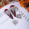 Joyas de lujo con lazo para uñas, ligeras y elegantes, en línea para celebridades, con un lazo encantador de perla y circonitas superbrillantes.