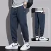 Pantalones deportivos cálidos con forro de felpa de marca de moda otoño e invierno 2026 para hombre, pantalones jogger holgados de color liso con cordón, pantalones largos para primavera