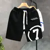 Verano 2023 nuevos shorts blancos estampados marca de moda para hombre pantalones deportivos holgados de cinco puntos pantalones de viaje para hombre Pantalones de playa