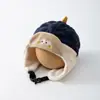Gorro de orejeras de dibujos animados para niños de otoño e invierno con forma de nuez, gorro Lei Feng de dinosaurio para bebé, gorro a bloques de color a prueba de viento y cálido para niños y niñas