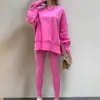 Conjunto de Moletom Amazon Outono/Inverno 2025 Feminino Europeu e Americano Casual Solto Manga Longa Gola Redonda Top com Fenda e Calça Longa Justa