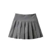 Nova Roupa Feminina de Primavera, Estilo Universitário, Rejuvenescedora, Saia Curta Evasê Anti-Exposição, Saia Plissada, Saia Retro de Cor Sólida de Cintura Alta