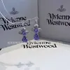Pendientes Saturno Estilo Western de Alta Gama Serie Ismene Planeta Completo en Diamante Clásico Pendientes Estrella Lágrima de Sirena
