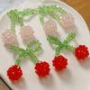Moño pequeño fresco de cristal doble cereza DIY tejido a mano con cuentas pasador accesorios para el cabello material para aretes al por mayor